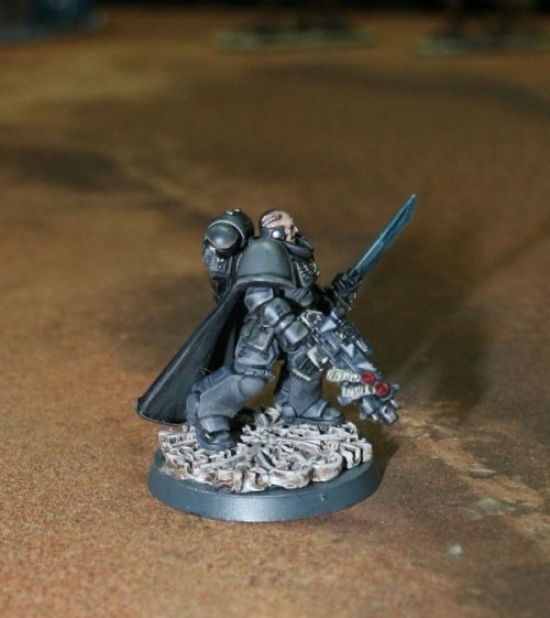 “Black ops” style space marine w/o chapter markings serving an...