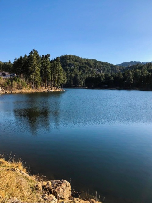 periscope-9 - Blue lake nestled in the Black Hills. By...