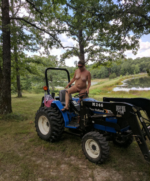 nudist-signs2 - Nudist drives a small tractor, farmer nudist...