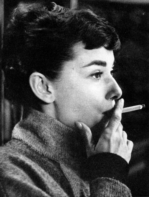 elzabethtaylor - Audrey Hepburn smoking on the back lot of...