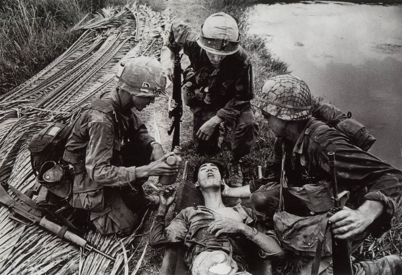 godshufflesherfeet:
“A vietcong soldier fought off American troops for three days, all while holding his insides inside a cooking bowl. Here, an American soldier offers his enemy clean water as a sign of respect for his courage in combat.
”
