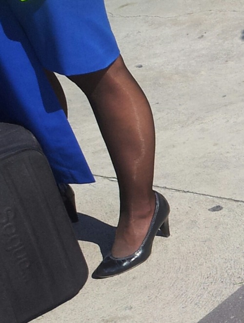stewardess with black pantyhose and heels