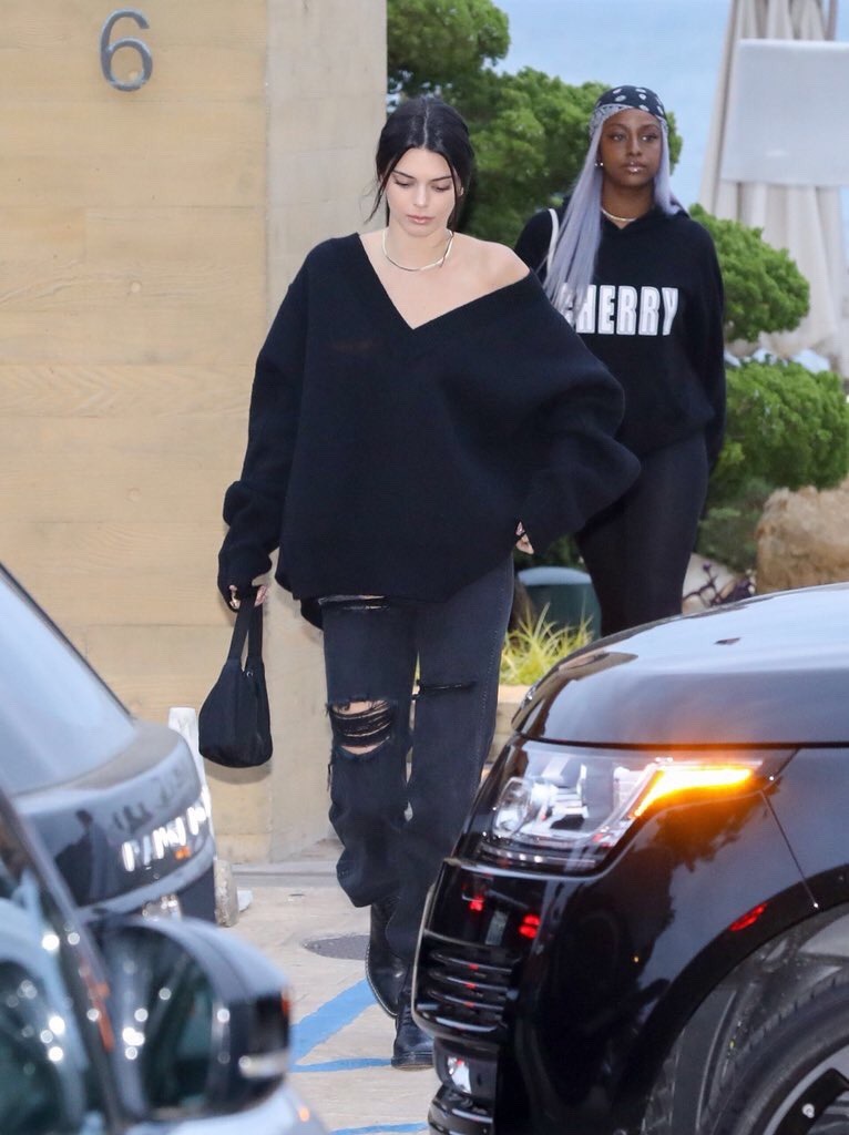   Kendall Jenner wearing a boyfriend black denim ripped ankle length jeans Street Style 2018