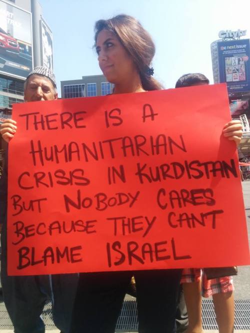 eretzyisrael - Sign at a Kurdish rally against ISIS persecution of...