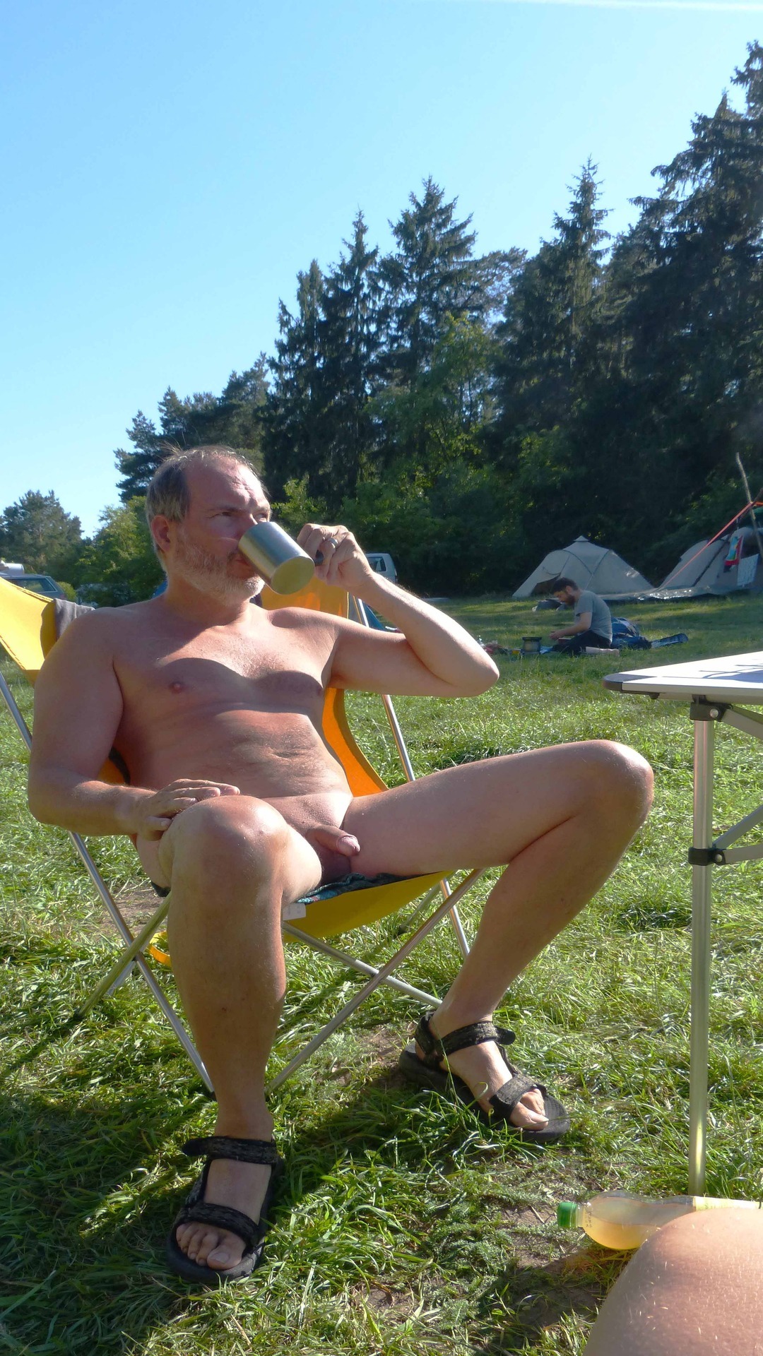 Married dude camping while wearing nothing but his dad vacation sandals