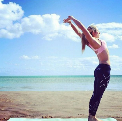 Beach side yoga session in 2XU tights.Source - lets.go_run /...