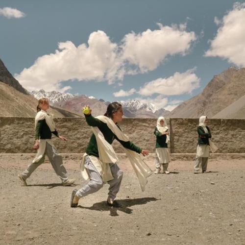 gharriya:Girls play a game of cricket during school break in...