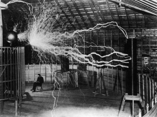 kittencrimson - Nikola Tesla sitting behind his Magnifying...