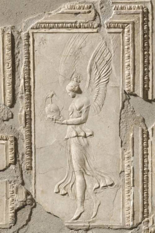 coolartefact - Winged Athena holding a helmet unearthed inside...