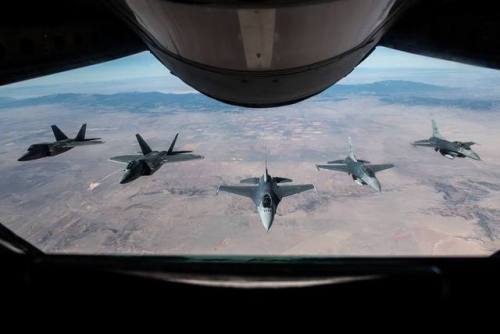 planesawesome - Two F-22 Raptors and three F-16 Fighting Falcons...
