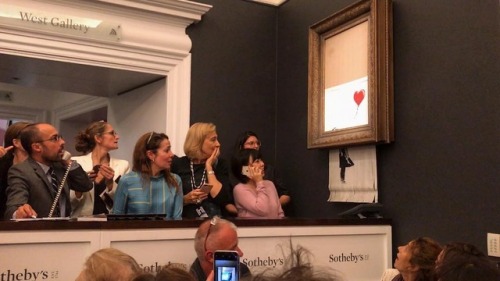 itscolossal:Banksy Painting Spontaneously Shreds Moments After...