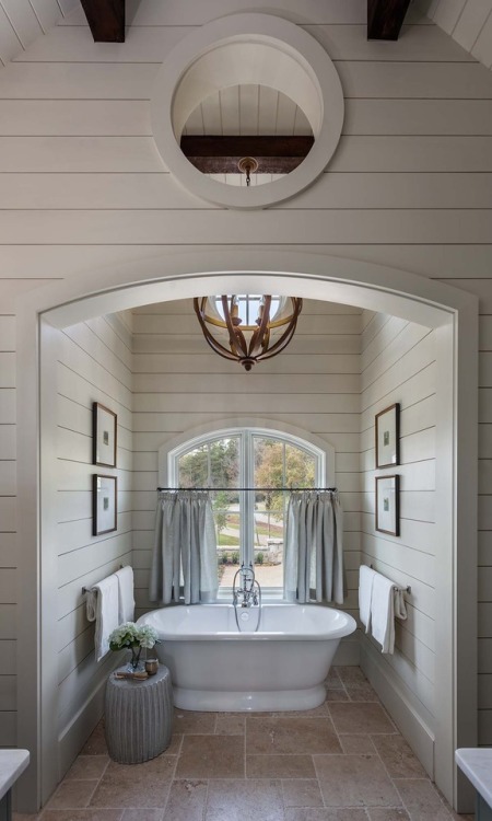 stylish-homes - Soaking tub has its own nook with shiplap trim...