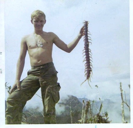 bundyspooks - A US soldier holds up a huge Jungle Centipede...