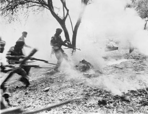 greasegunburgers - Men of a Sikh regiment clear a Japanese...