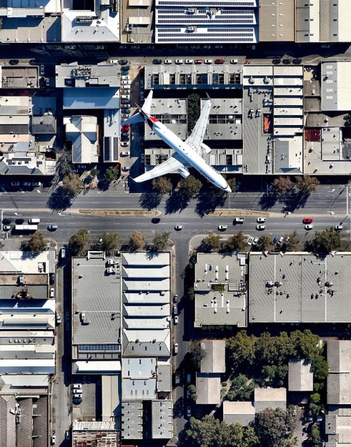 dailyoverview - A Qantas jet flies over Wakefield Street in...