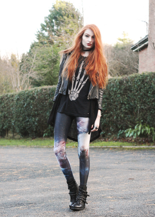 Olivia in galaxy print leggings, combat boots, leather jacket...