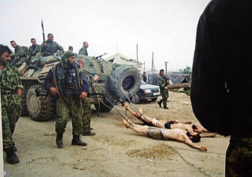 greasegunburgers - Russian Army forces drag dead Chechen...
