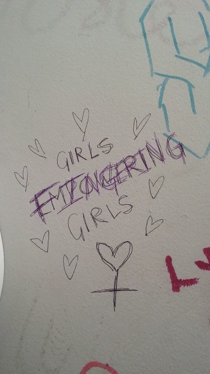 queergraffiti - “Girls empowering girls” written over to become...