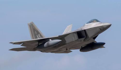 planesawesome - F-22 with external fuel tanks.
