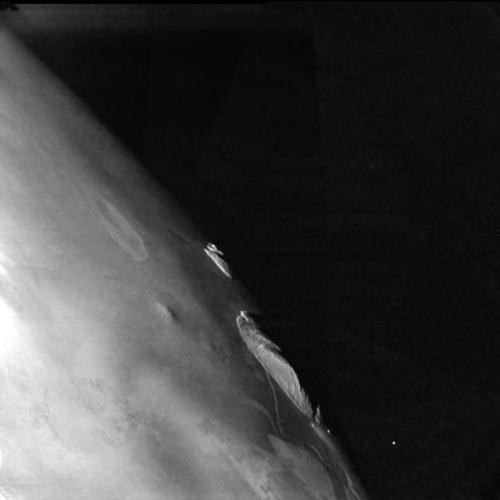 photos-of-space - Close encounter with Io. Mountains at the...