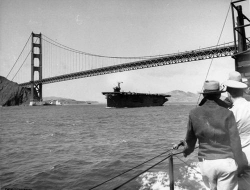 warhistoryonline - USS Copahee passing under the Golden Gate...