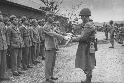 greasegunburgers - American officer accepting the sword of a...