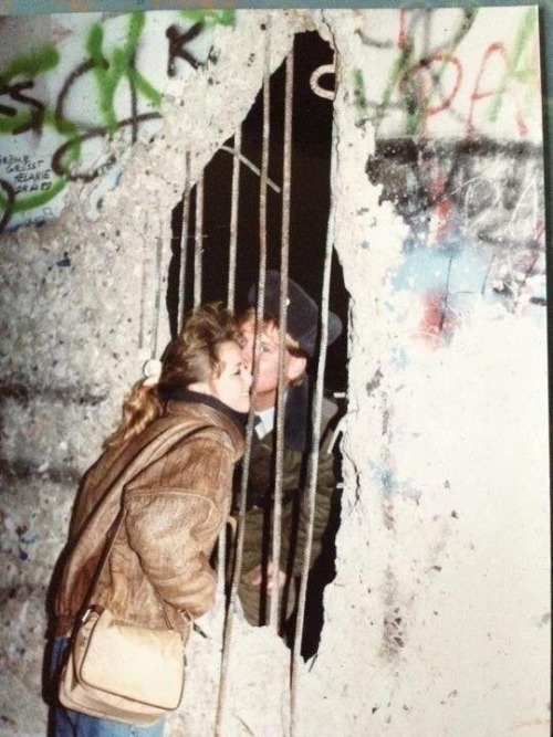 historicaltimes - Sneaking a kiss through the Berlin Wall via...