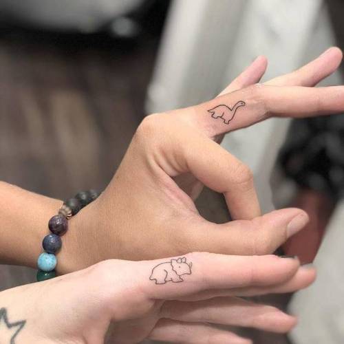 Tattoo tagged with: dinosaur, small, best friend, matching, brontosaurus,  finger, micro, tiny, love, ifttt, little, minimalist, triceratops, fine  line, matching tattoos for best friends, chang, line art, animal |  