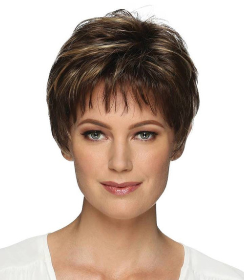 Short pixie style with soft wispy volume & tapered nape....